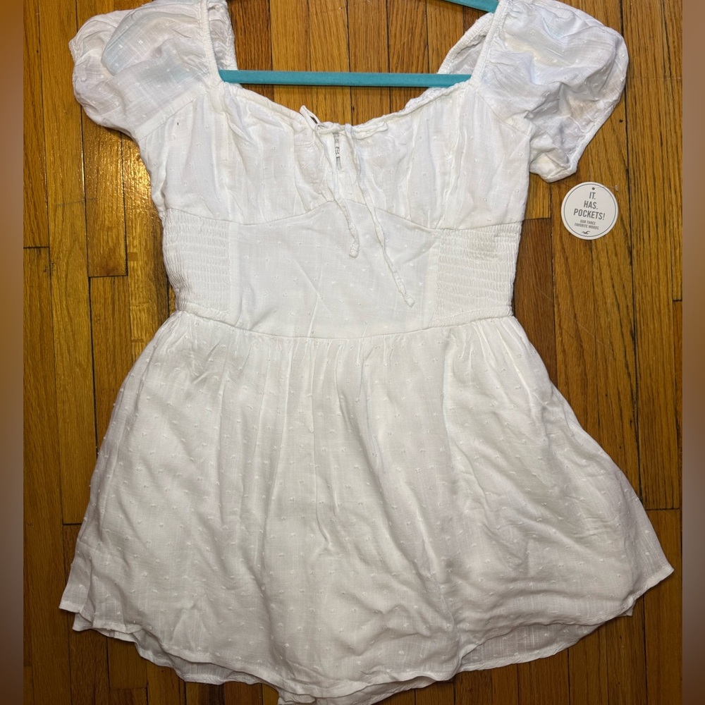 White cottage core romper with smocked waist in size M